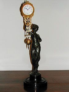 Bronze cupid statue swinger clock