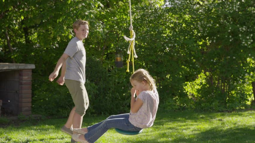 Camber reccomend Boy and girl swinging on a rope