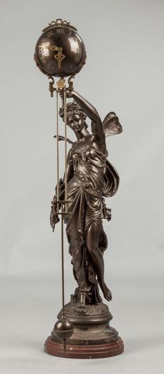 bronze cupid statue swinger clock