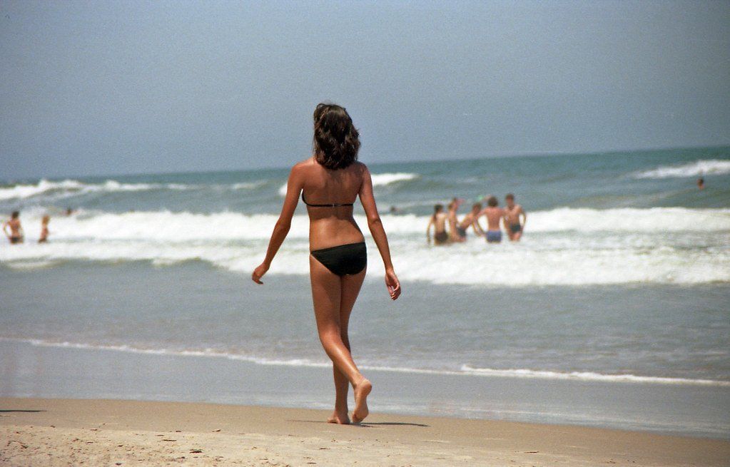 Girls walking on beach in bikini