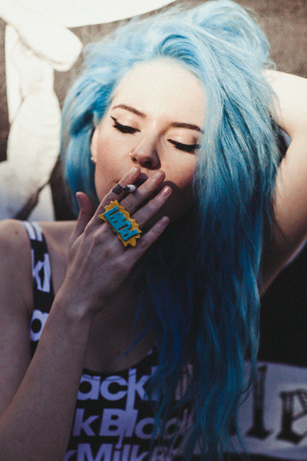 Girl bikini smokes cigarette skinny body